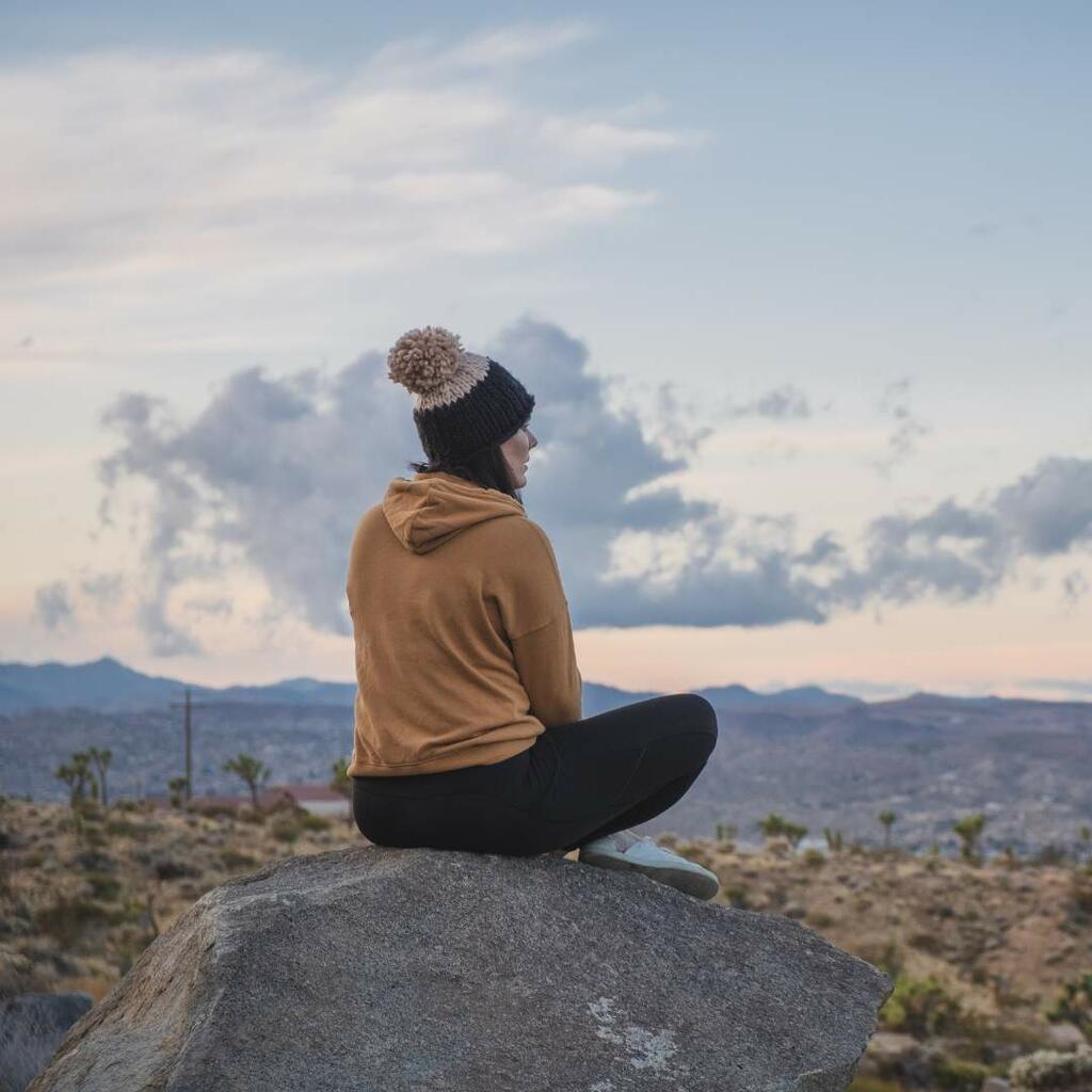 Woman alone on rock